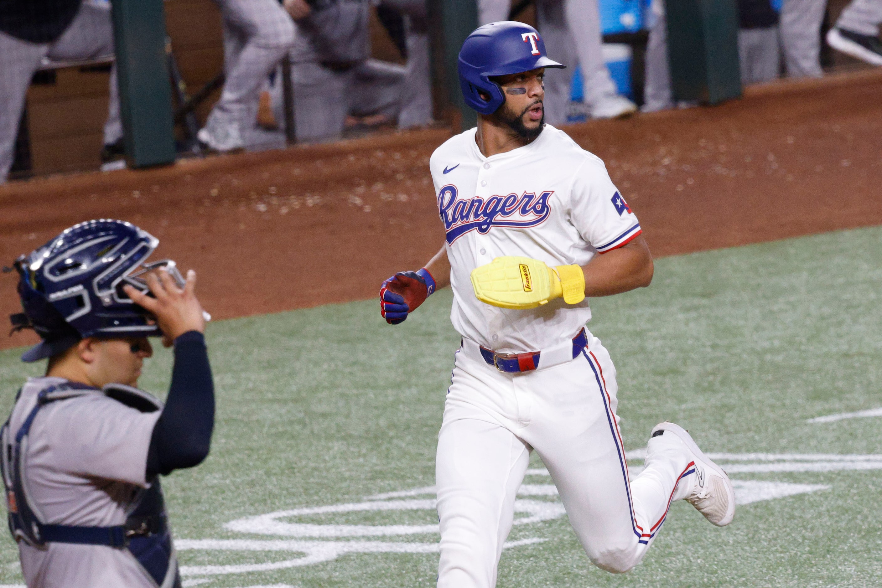 Texas Rangers Texas’ Leody Taveras (3) looks at his teammate Ezequiel Duran (20)’s double as...