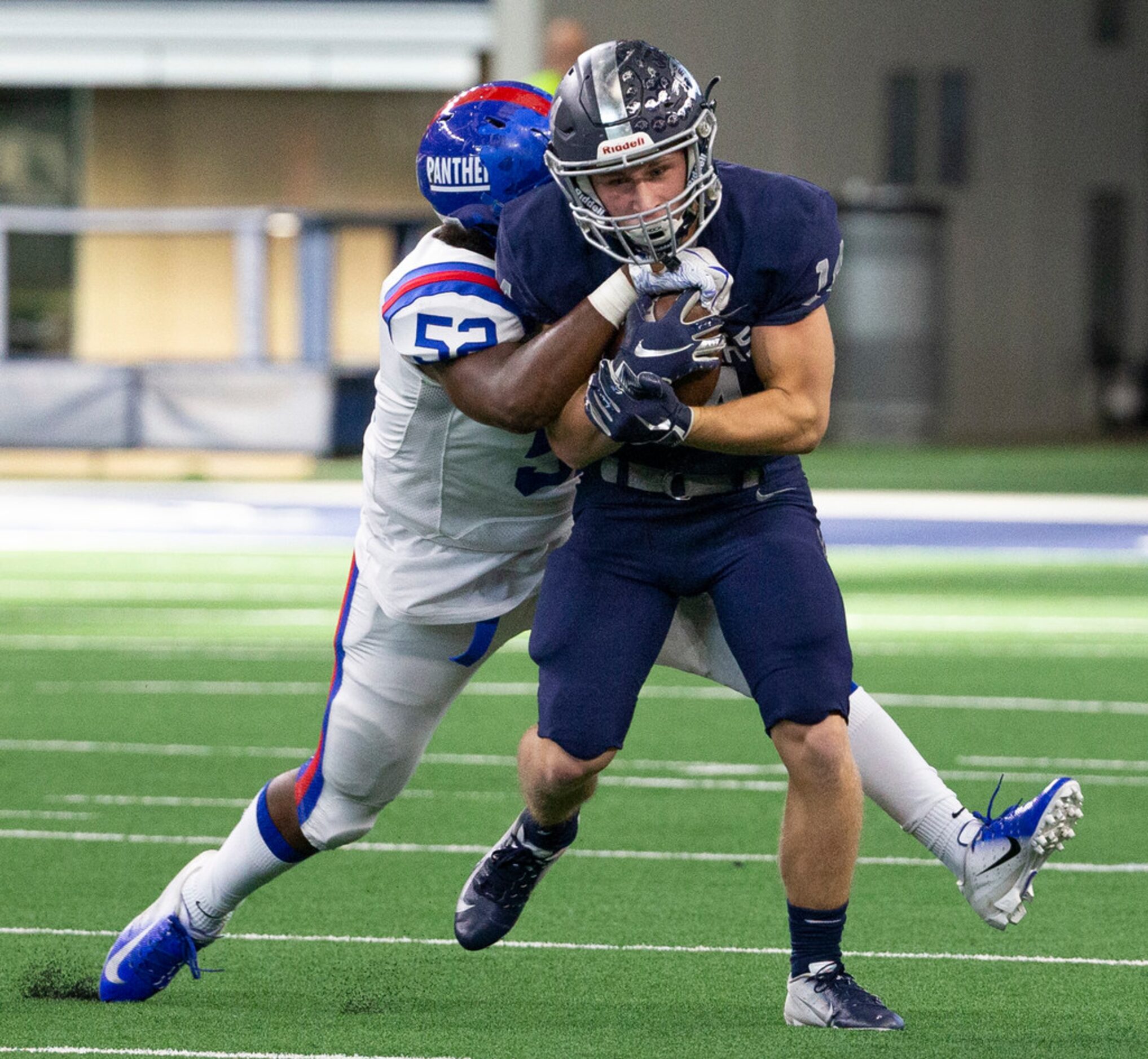 Flower Mound receiver Reece Carter (14) gets sacked by Duncanville linebacker Amari Wynn...