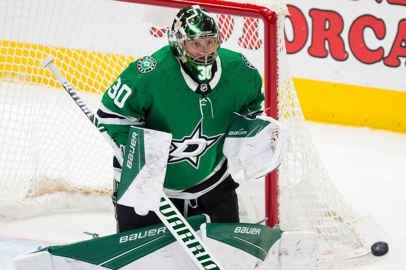 Dallas Stars goaltender Ben Bishop (30) makes a save on a shot by the Buffalo Sabres' Henri...