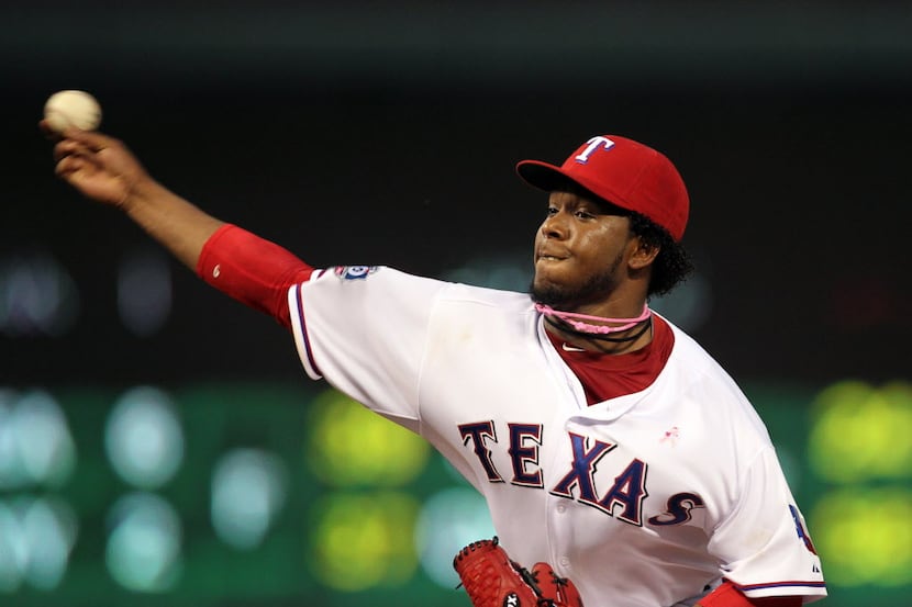 Texas Rangers starting pitcher Neftali Feliz (30) throws against the Los Angeles Angels in...