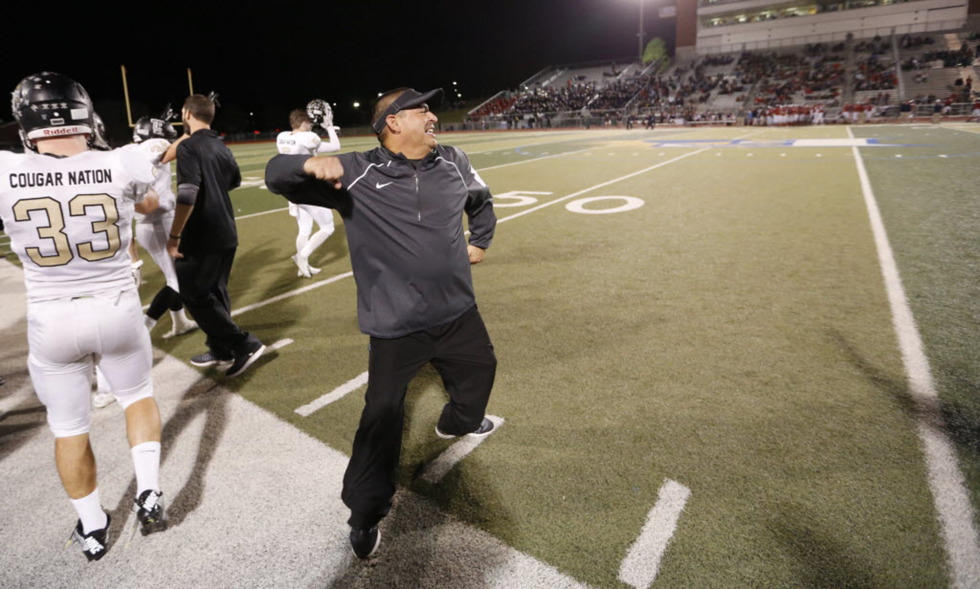 The Colony's head football coach Rudy Rangel celebrates after defeating Frisco Centennial at...