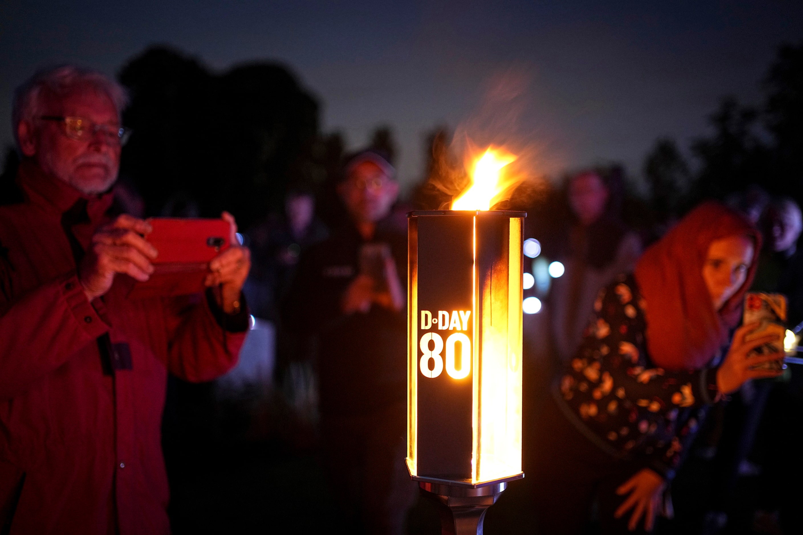 A flame shines in the Commonwealth war cemetery of Banneville-La-Campagne, Normandy, France,...