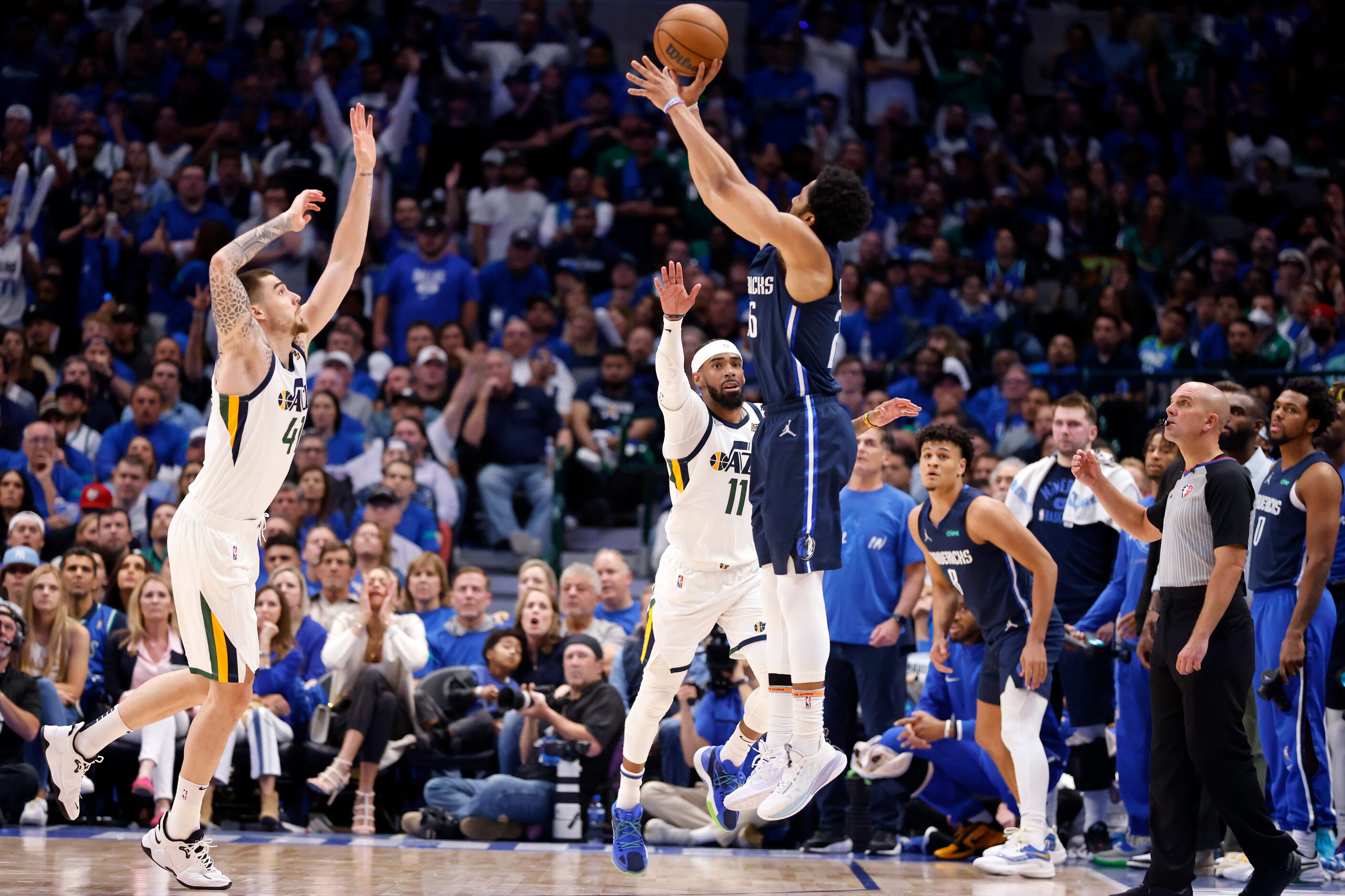 Dallas Mavericks guard Spencer Dinwiddie (26) puts up and makes a three-pointer against Utah...