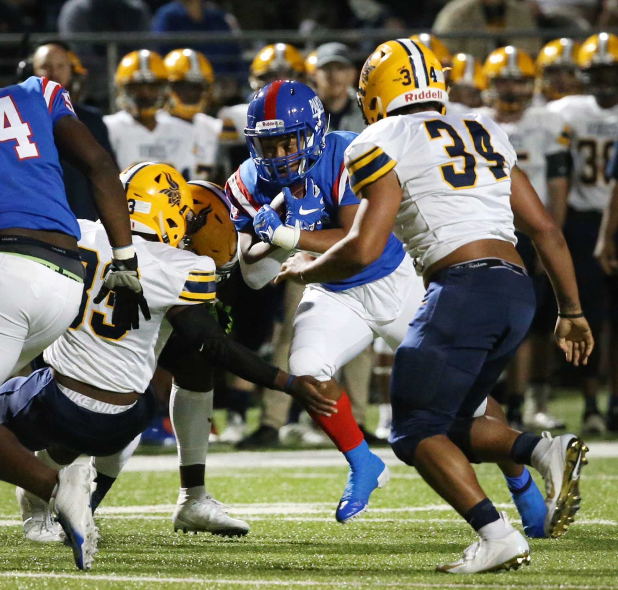 Duncanville running back Trysten Smith (9) runs the ball against the Arlington Lamar defense...