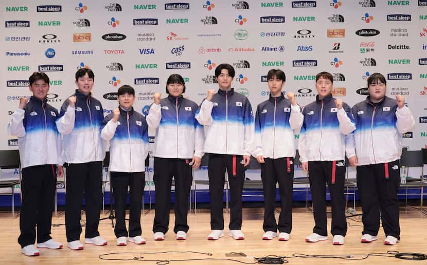 South Korean national team members wear uniforms for the medal ceremony for the Paris 2024...