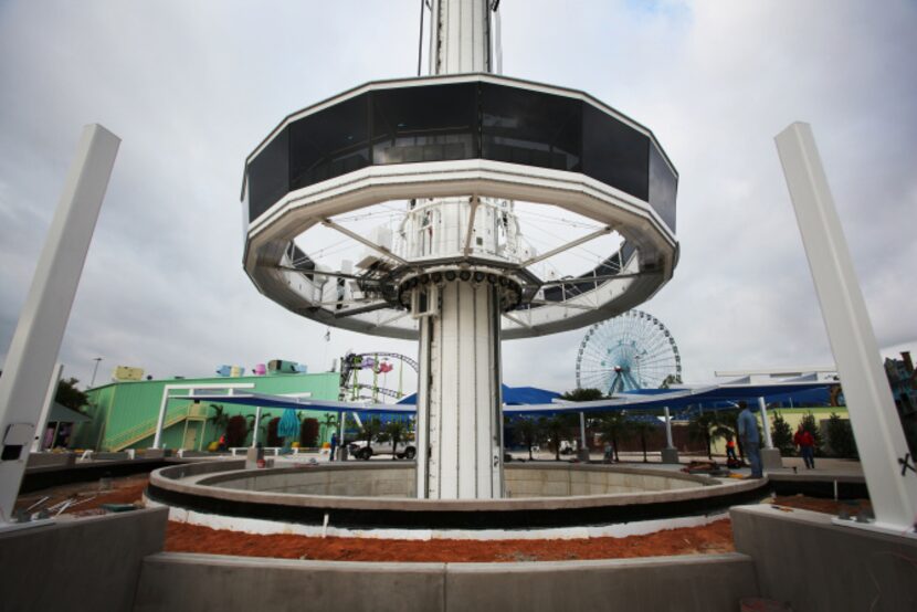 A passenger gondola is lowered for repairs on the 500-foot Top Oaï Texas Tower part of...