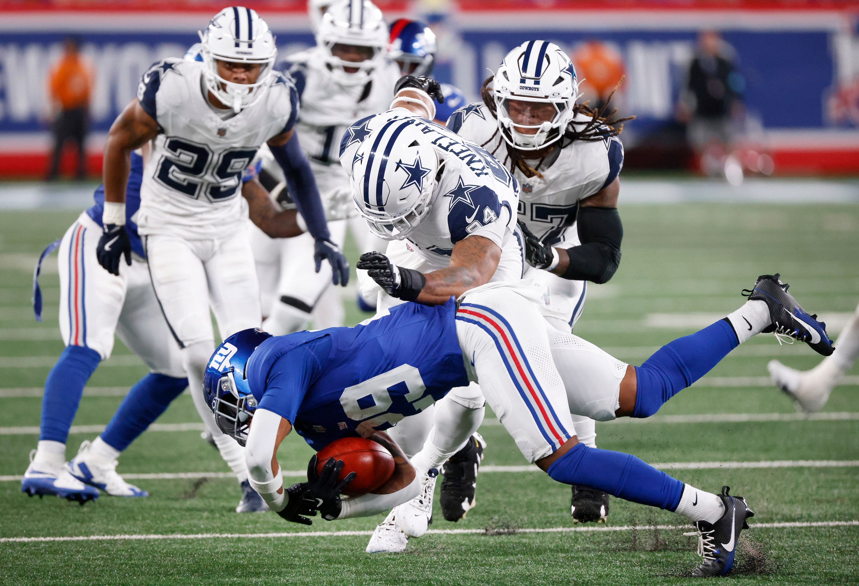 Dallas Cowboys defensive end Marshawn Kneeland (94) throws New York Giants running back...