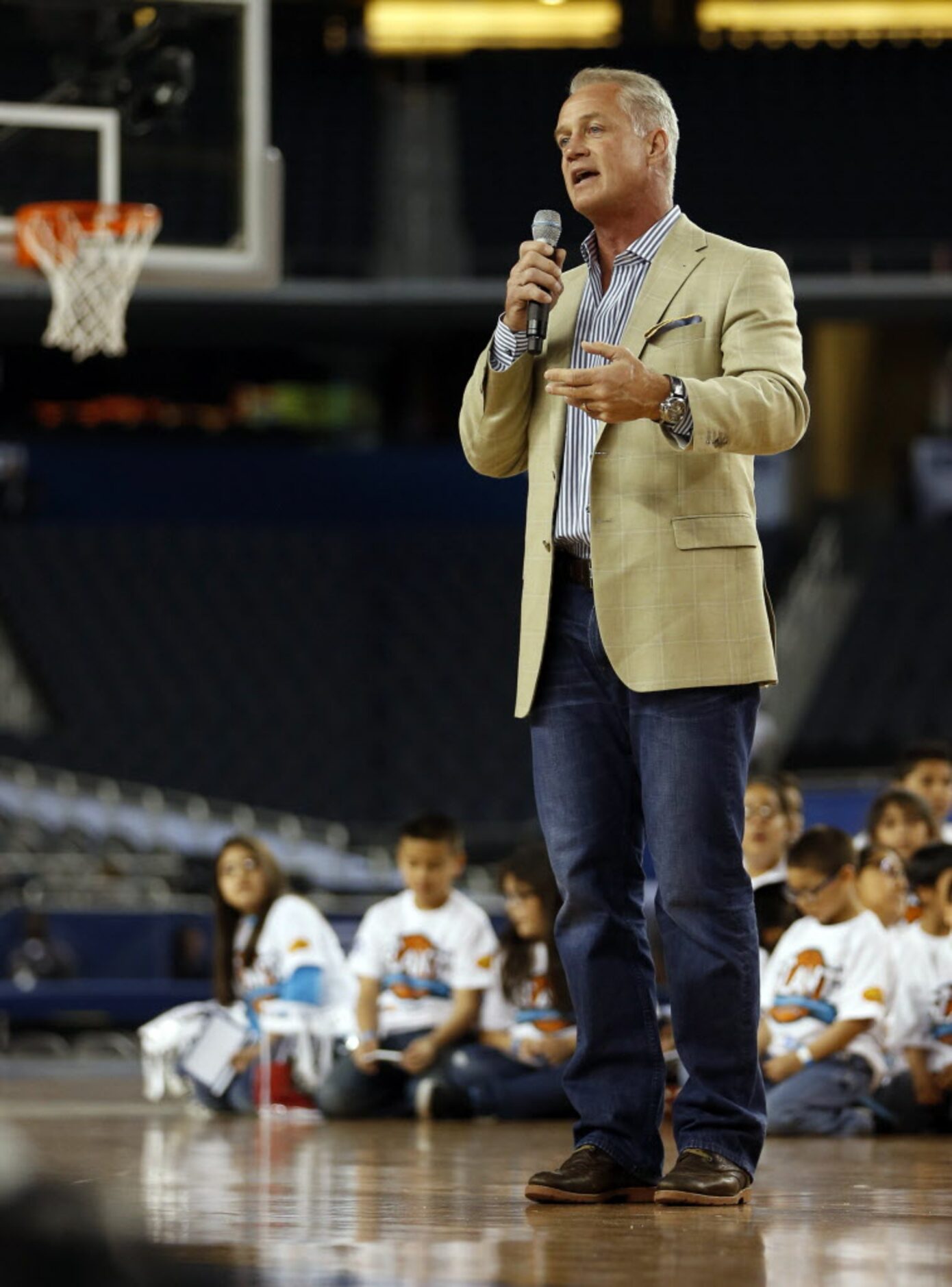 Former Dallas Cowboys player Daryl Johnston speaks during the Reese's Final Four Slant...