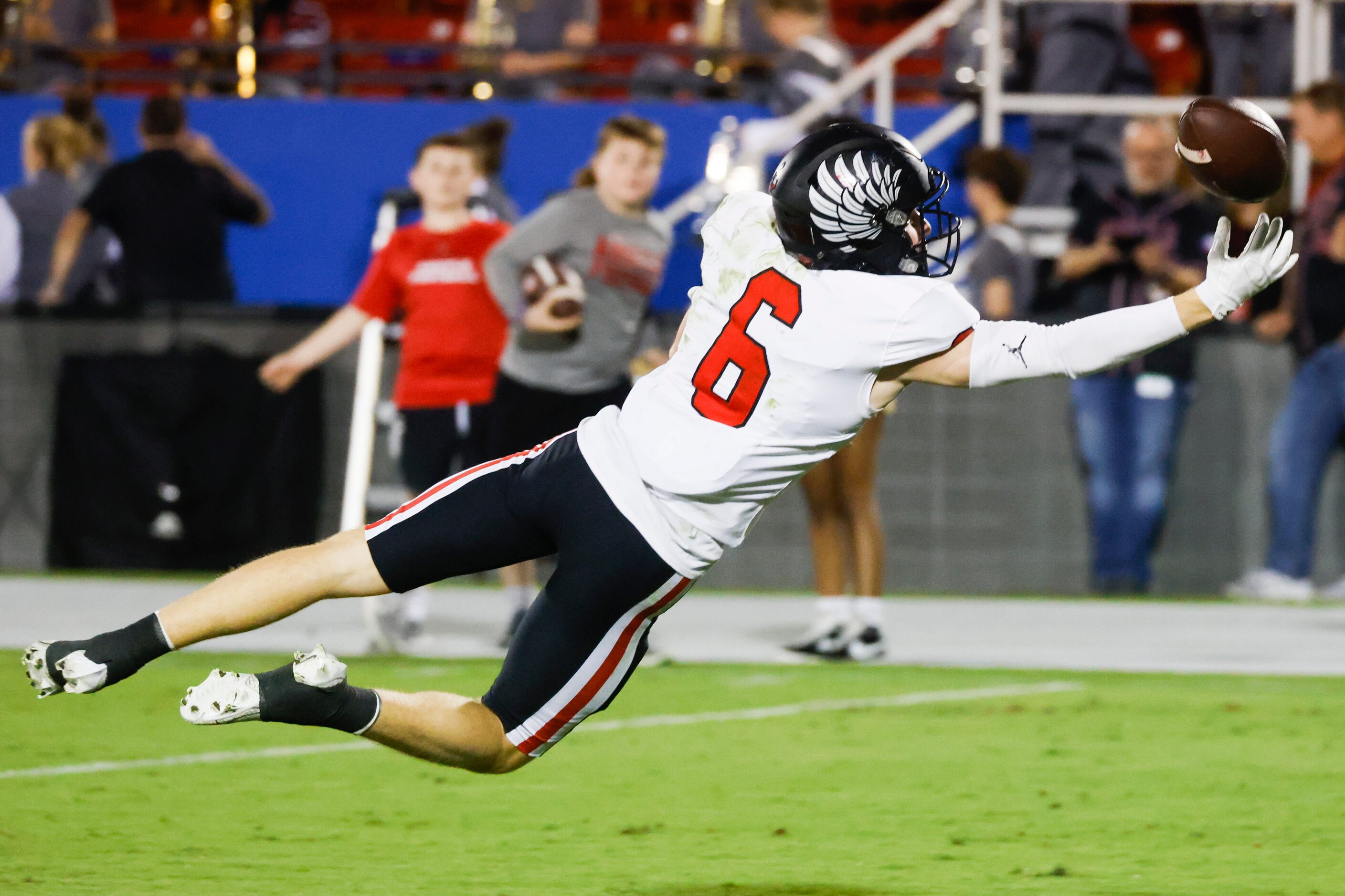 Argyle high school’s Lane Stewart (6) misses to receive a pass against Emerson high school...