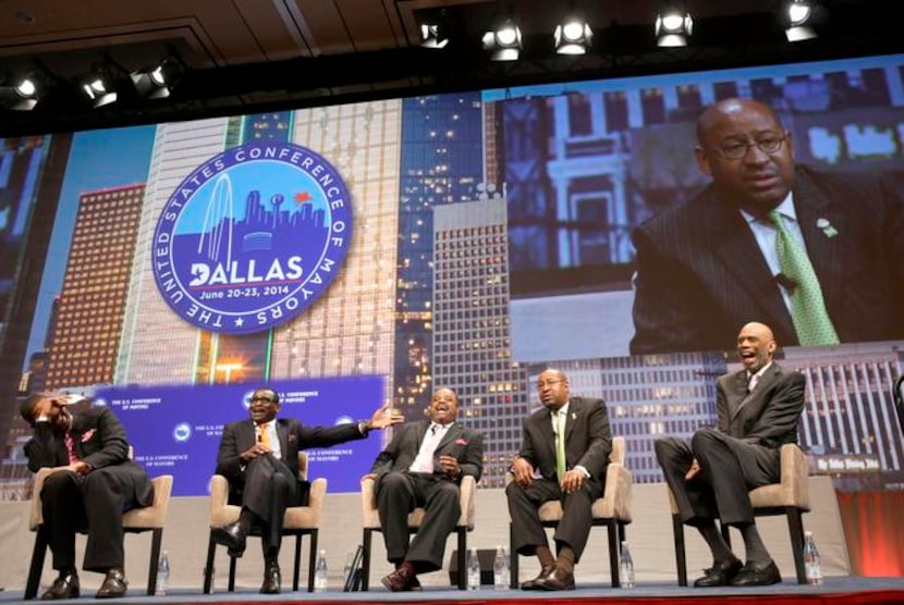 
Former Dallas Cowboys player Michael Irvin, second from left, makes a statement during...