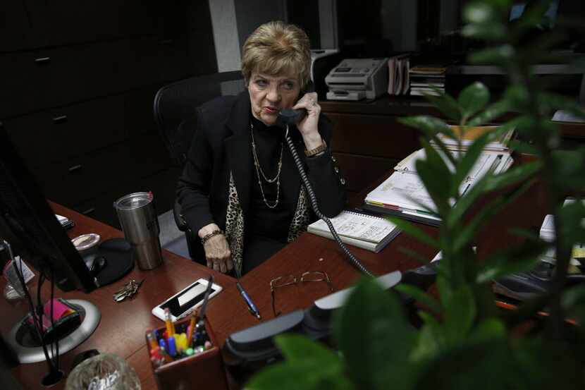 Marylyn Love, longtime secretary for Dallas Cowboys owner Jerry Jones, takes a phone call at...