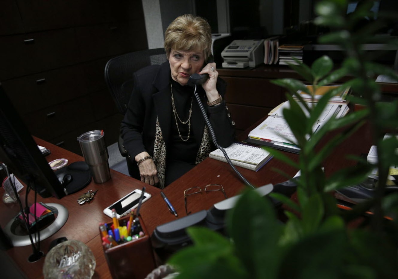 Marylyn Love, longtime secretary for Dallas Cowboys owner Jerry Jones, takes a phone call at...