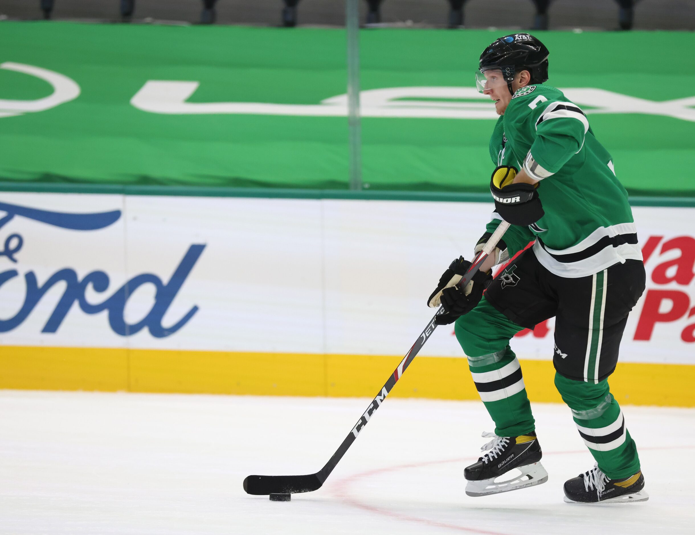 Dallas Stars defenseman John Klingberg (3) advances the puck in a game against the Detroit...