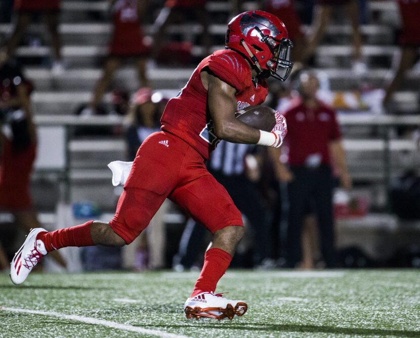 Mesquite Horn defensive back Micah Rogers (29) runs the ball after an interception during...