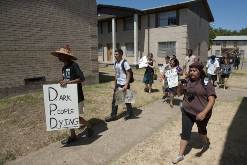 Protesters marched through the Southdale Apartments in the Dixon Circle neighborhood on...