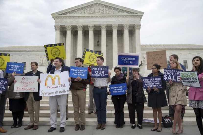 
Protesters rally after the Supreme Court striuck down certain limits on federal campaign...