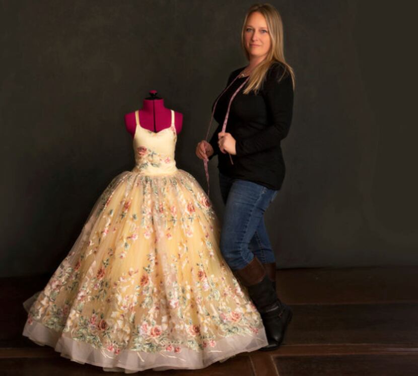 Bee J Stanley of Keller shows one of her dress designs. Stanley is the owner of Blutterfly...