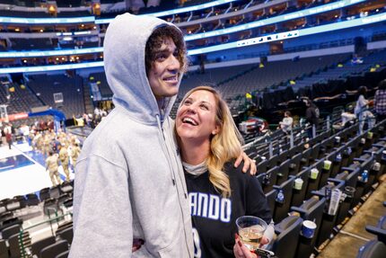 Orlando Magic guard Anthony Black hugs his mother Jennifer Black after his first NBA game...