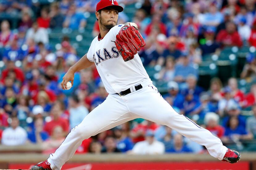 Texas Rangers starting pitcher Yu Darvish (11) throws a pitch against the Phillies during...