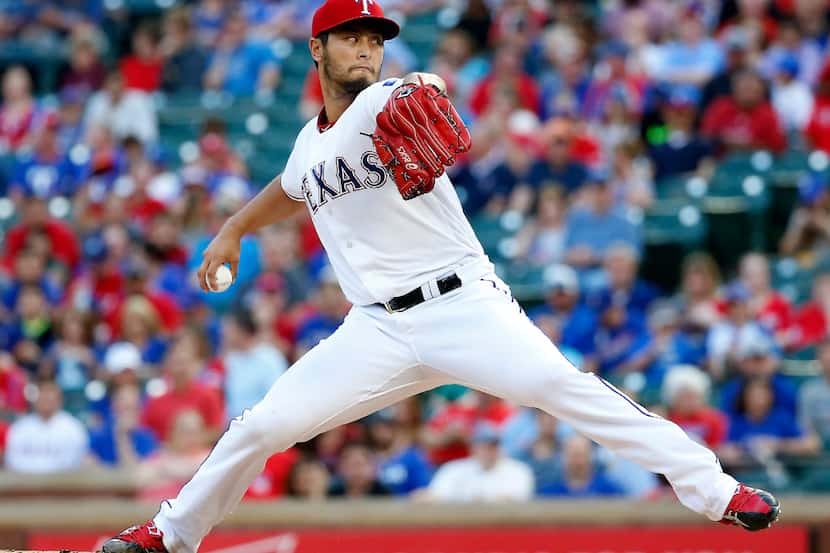 Texas Rangers starting pitcher Yu Darvish (11) throws a pitch against the Phillies during...