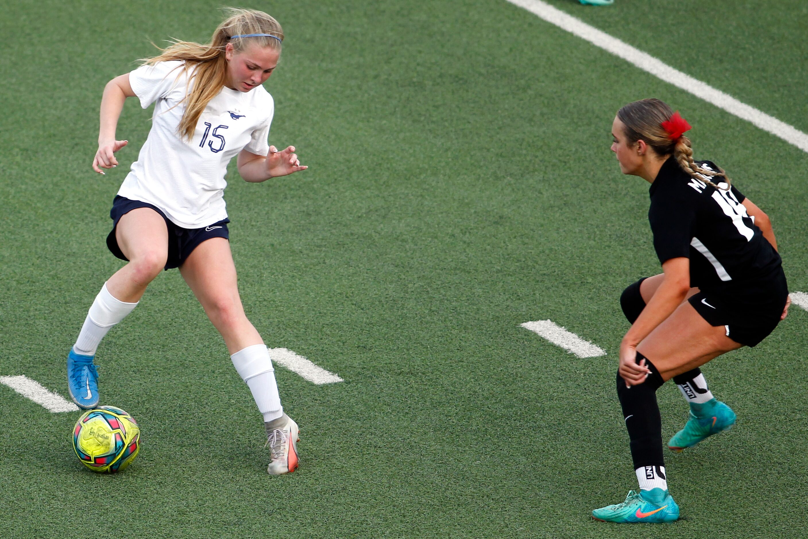 Richardson JJ Pearce player Ashtyn Singleton (15)applies the brakes as she negotiates a path...