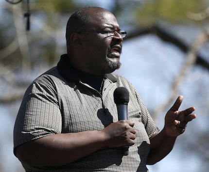 Pastor Eugene Keahey spoke during a prayer vigil outside Mt. Zion Baptist Church in the...