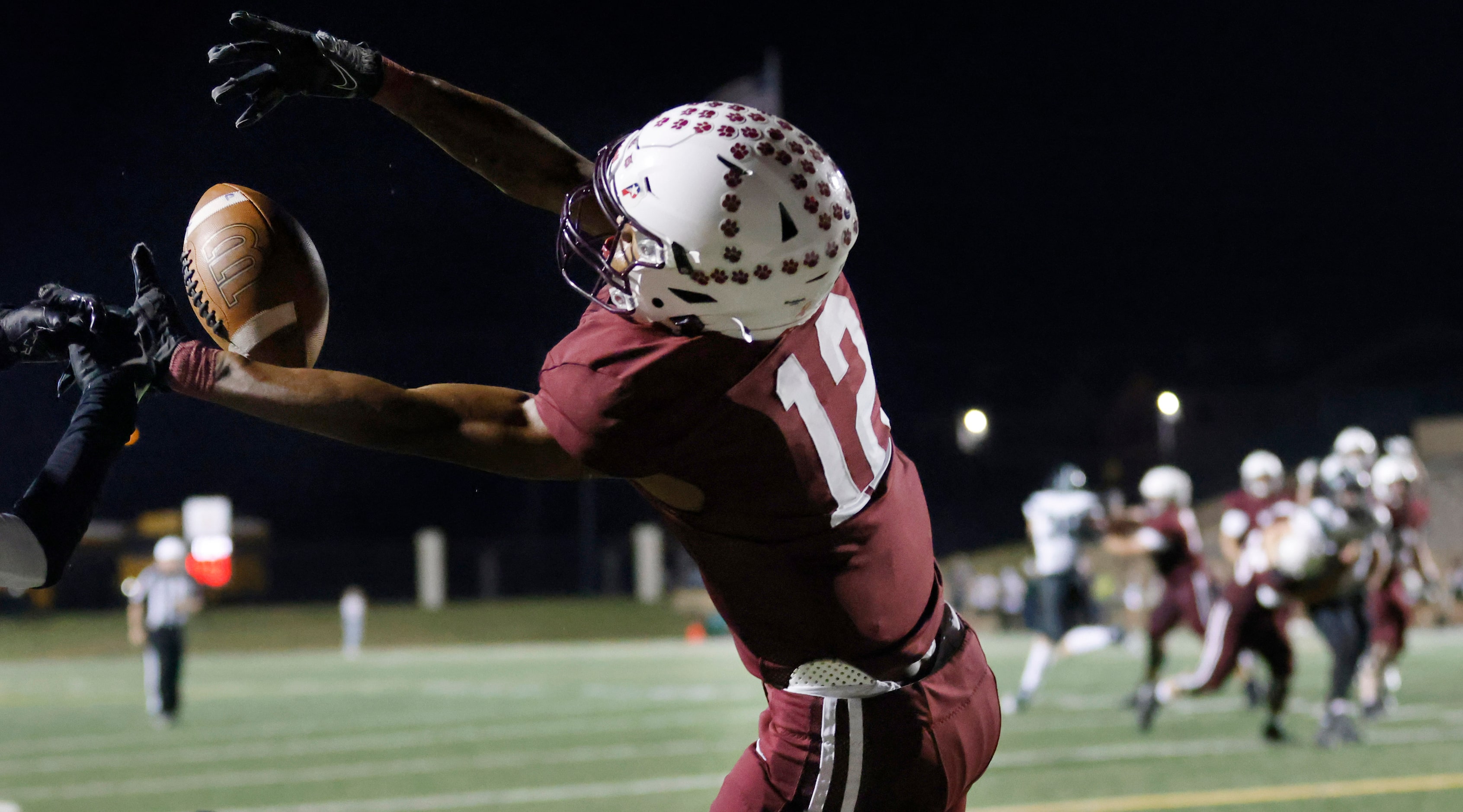 Plano High receiver Jordan Hayes (12) catches a second half touchdown in the end zone...