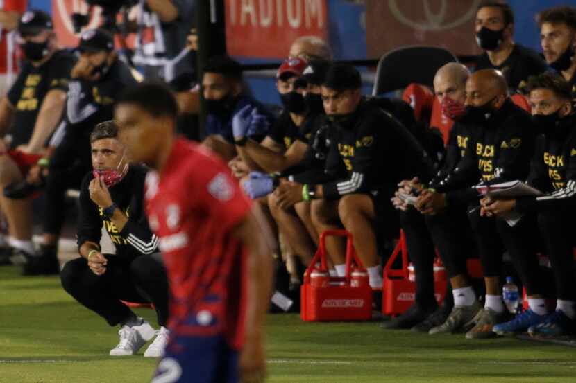 FC Dallas head coach Luchi Gonzalez intently follows the action in front of the team bench...
