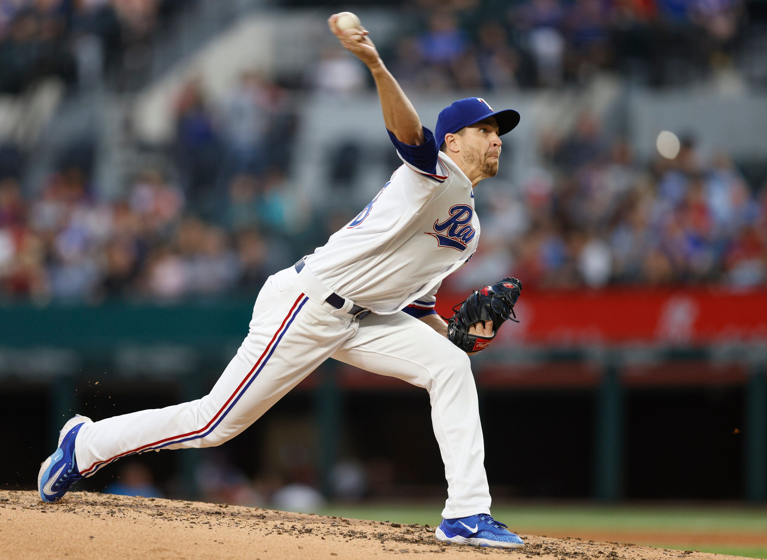 Texas Rangers starting pitcher Jacob deGrom (48) delivers a pitch during the third inning of...