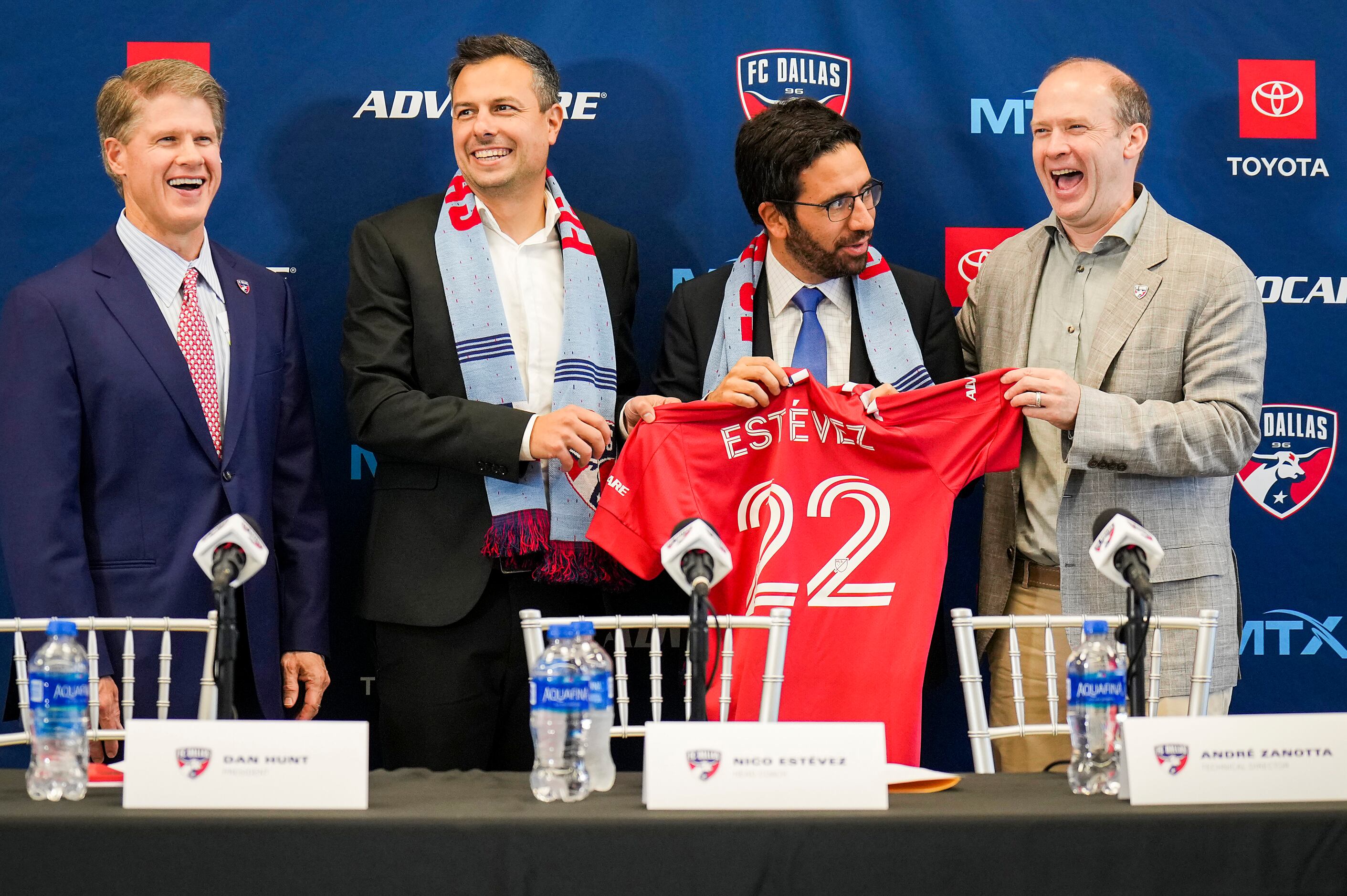 New FC Dallas head coach Nico Estévez (second from left) laughs with, from left, team...