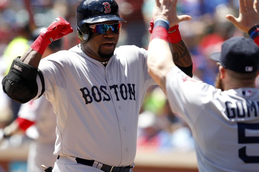 Boston Red Sox designated hitter David Ortiz (34) celebrates a two run home run with...