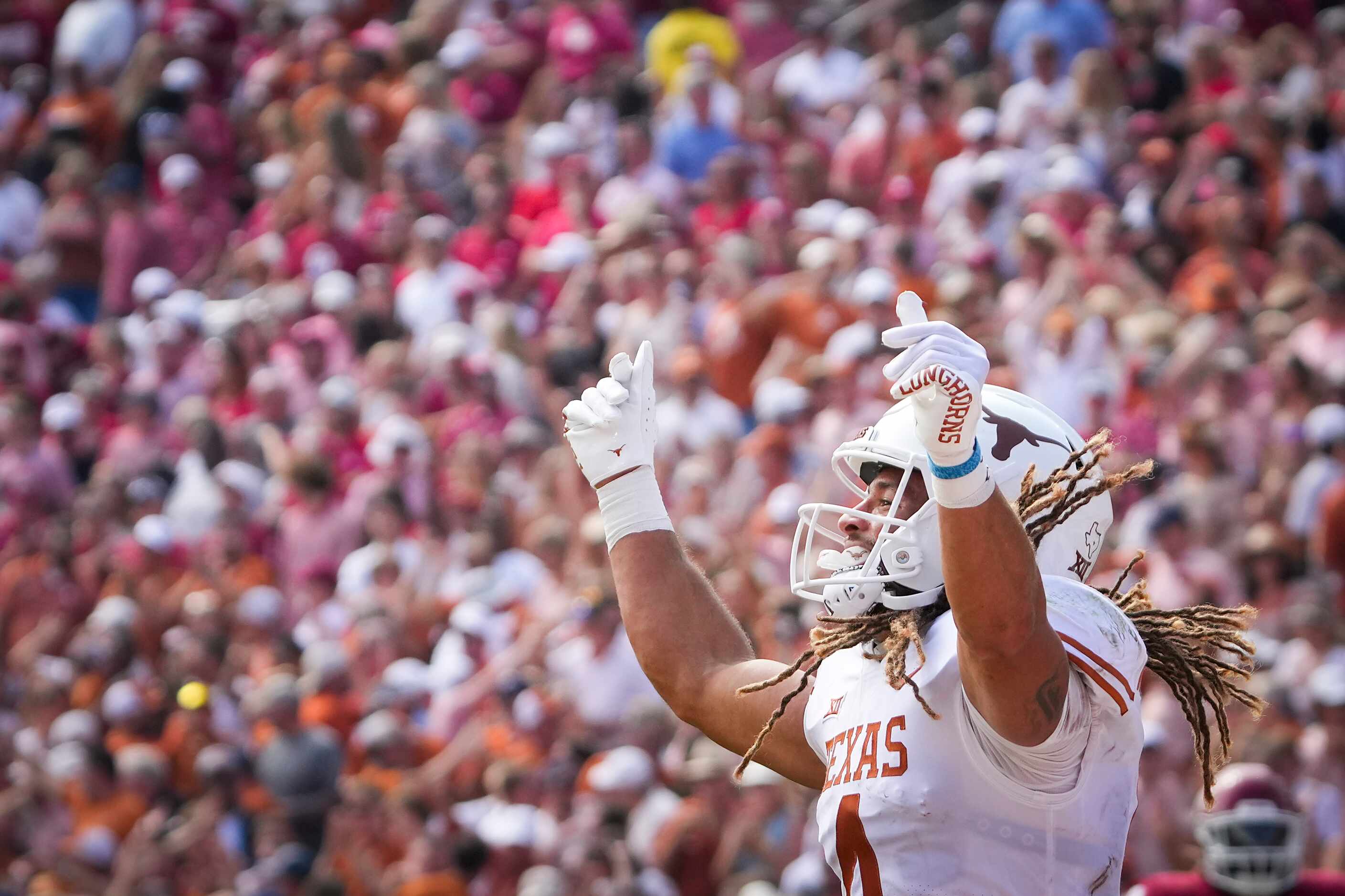 Texas wide receiver Jordan Whittington (4) celebrates after a Longhorns touchdown during the...