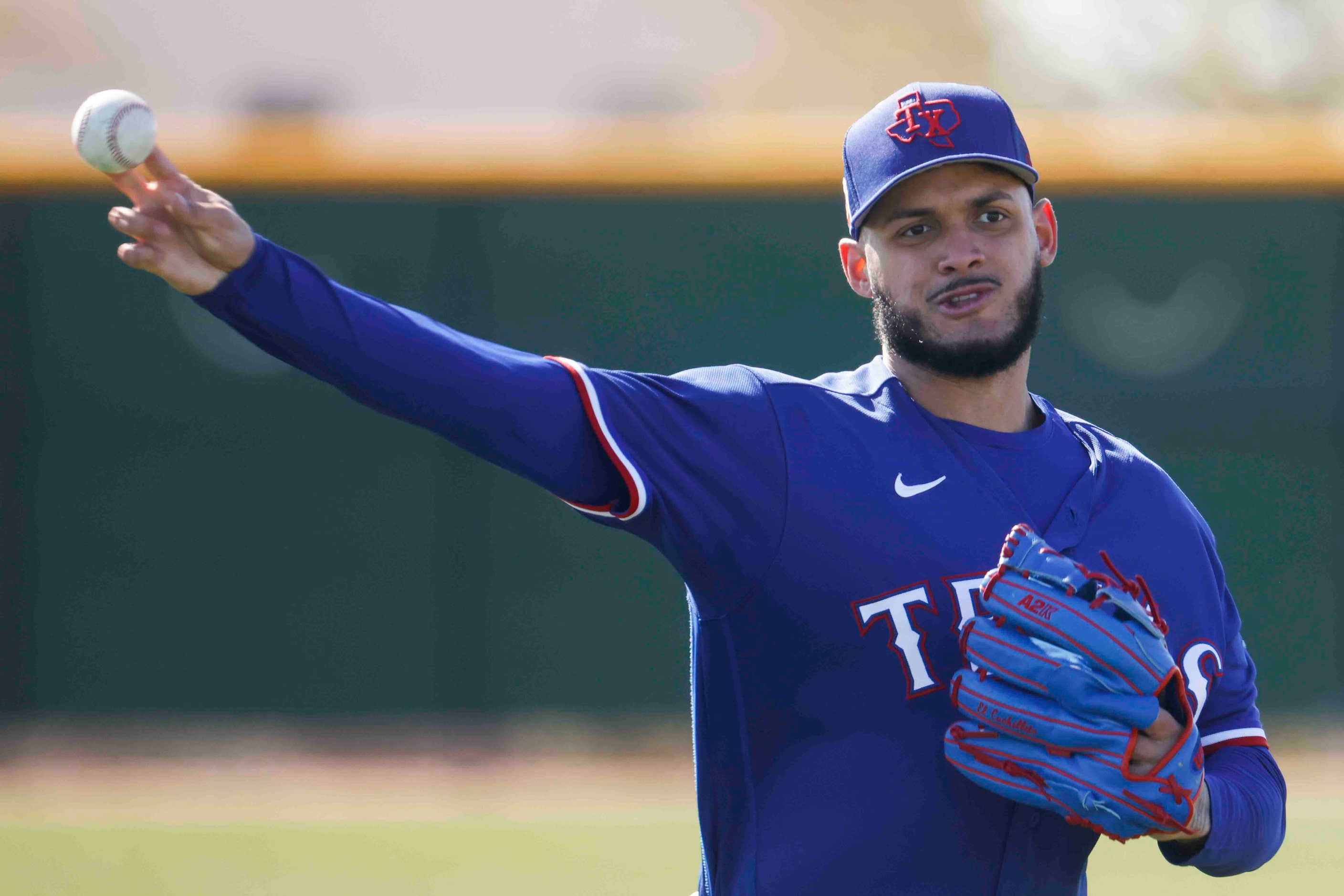 Texas Rangers right handed pitcher Jonathan Hernández throws a pitch during a spring...