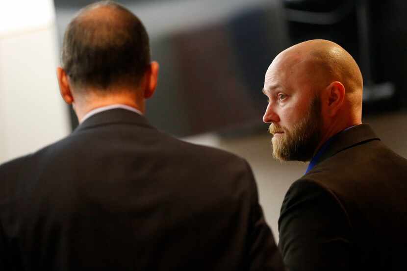 Roy Oliver (right) spoke with defense attorney Bob Gill after a hearing to delay his trial,...