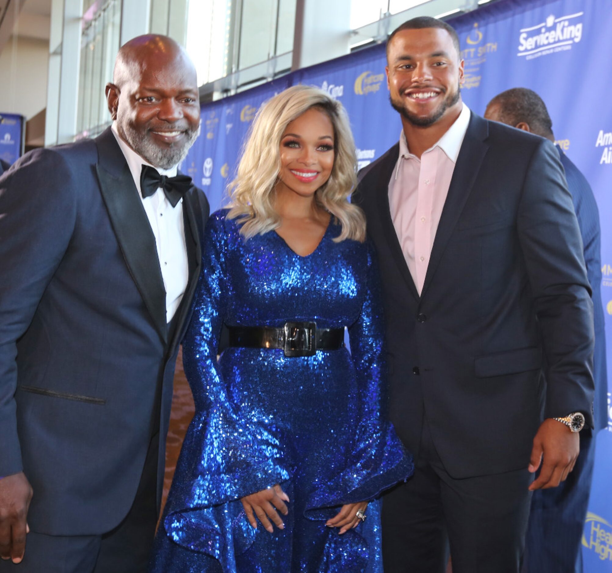 Dallas Cowboys legendary running back Emmitt Smith, left, poses with his wife Pat Smith and...