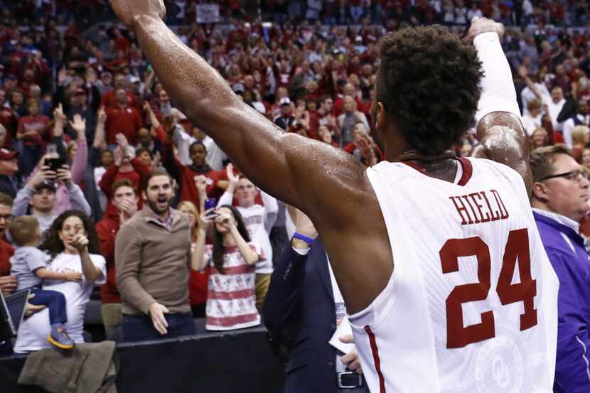 Oklahoma guard Buddy Hield (24) gestures to the Oklahoma crowd following a second-round...