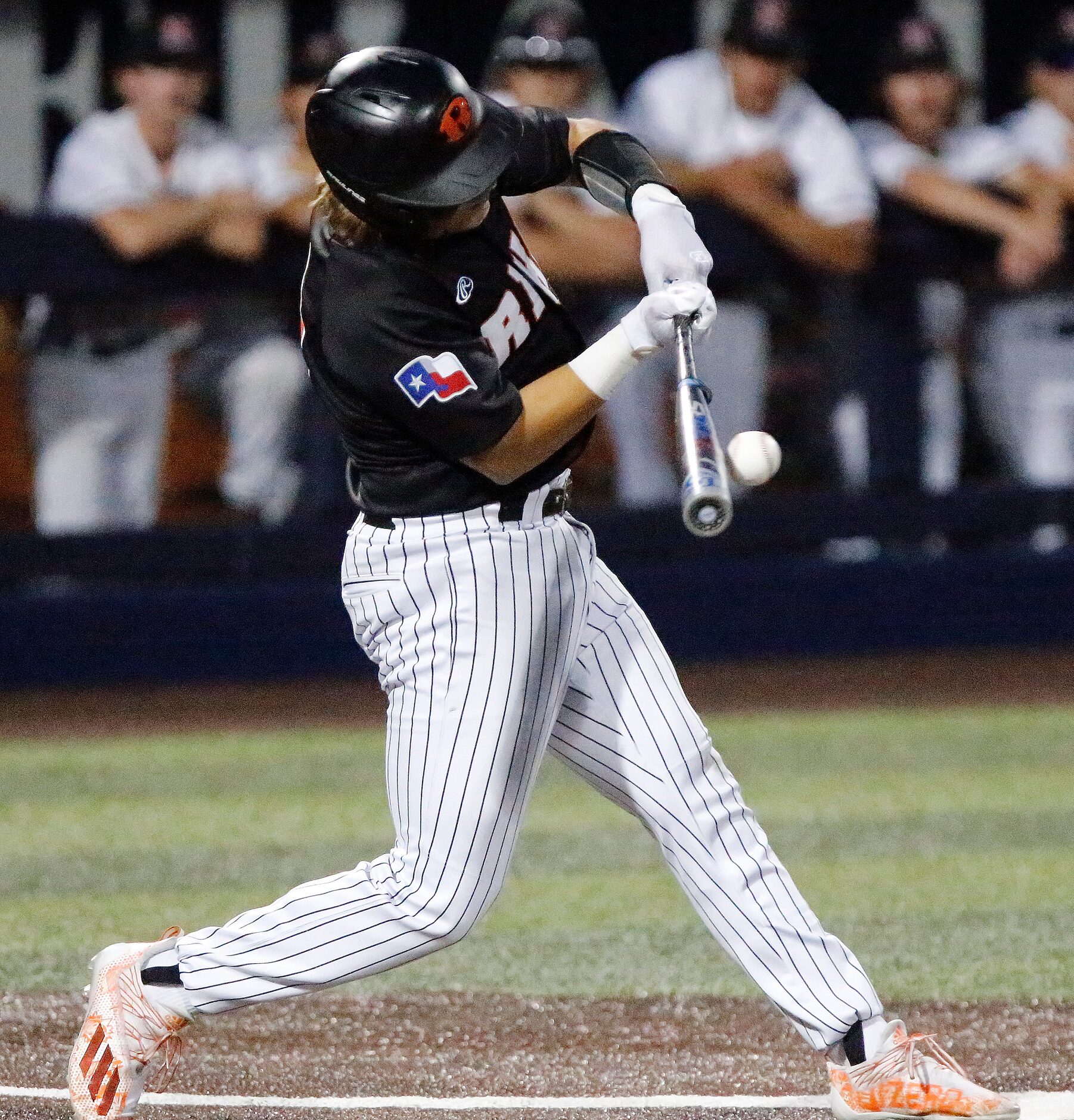 Rockwall first baseman Mac Rose (6) hits the ball in the fifth inning as Rockwall Heath High...