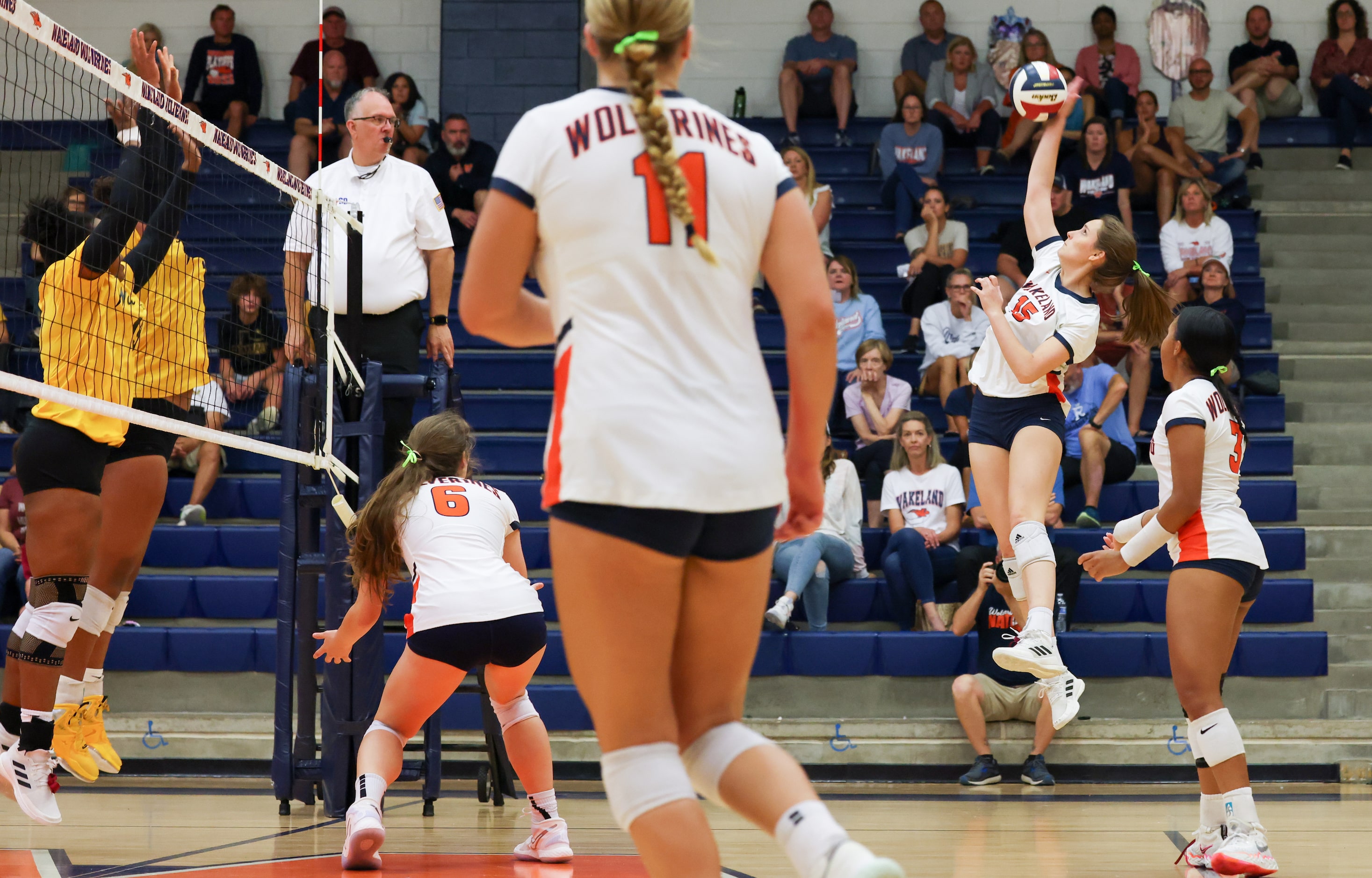 Frisco ISD’s Wakeland High School Eryn Peek (15) spikes the winning point during the third...