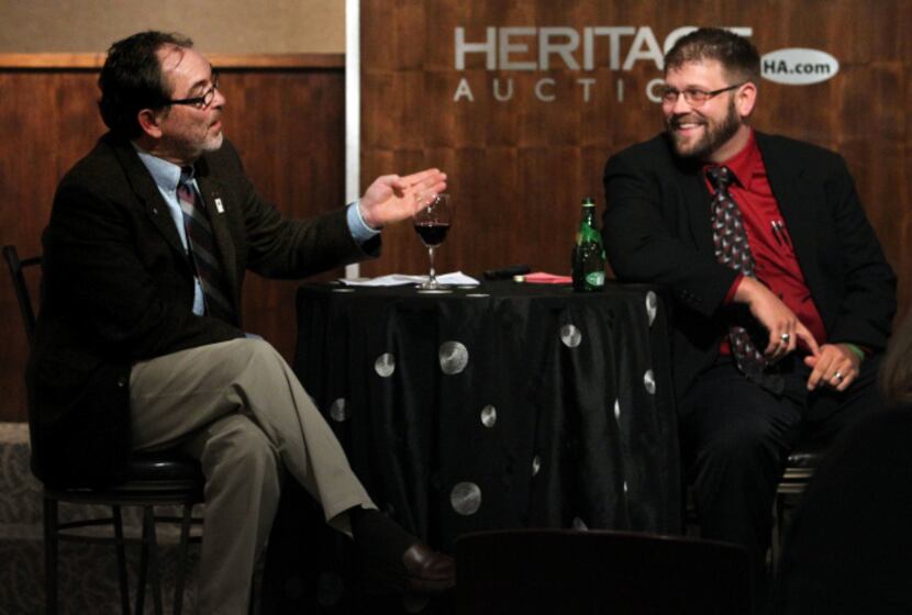 Don Hobbs of Flower Mound (left) talks about Sherlock Holmes with Joe Fay,  rare book...