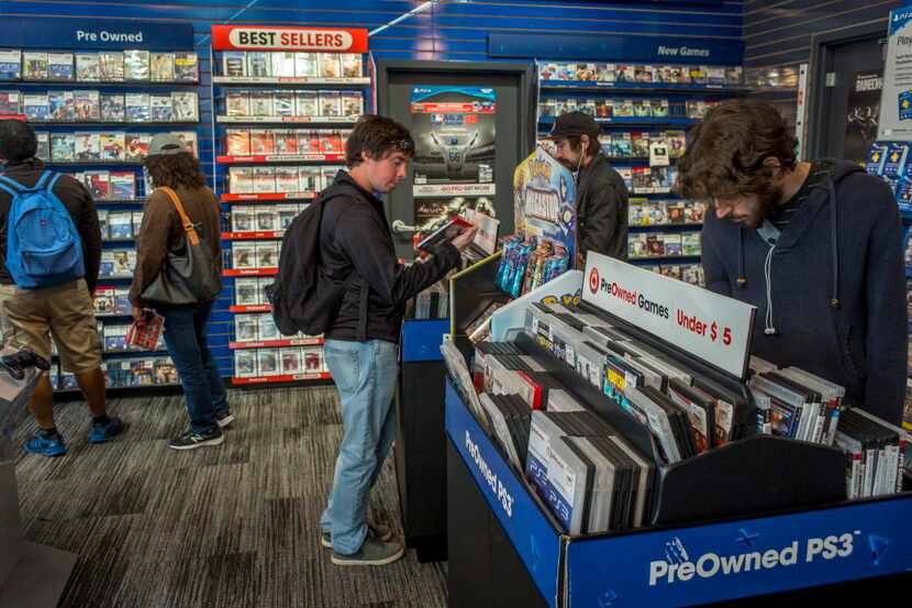 Customers view video games on sale at a GameStop Corp. store in San Francisco, California,...