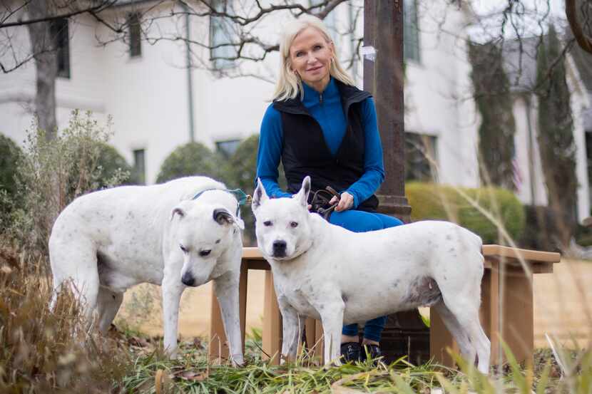Susan Hawk, attorney and former Dallas County district attorney, poses with her dogs, Murray...