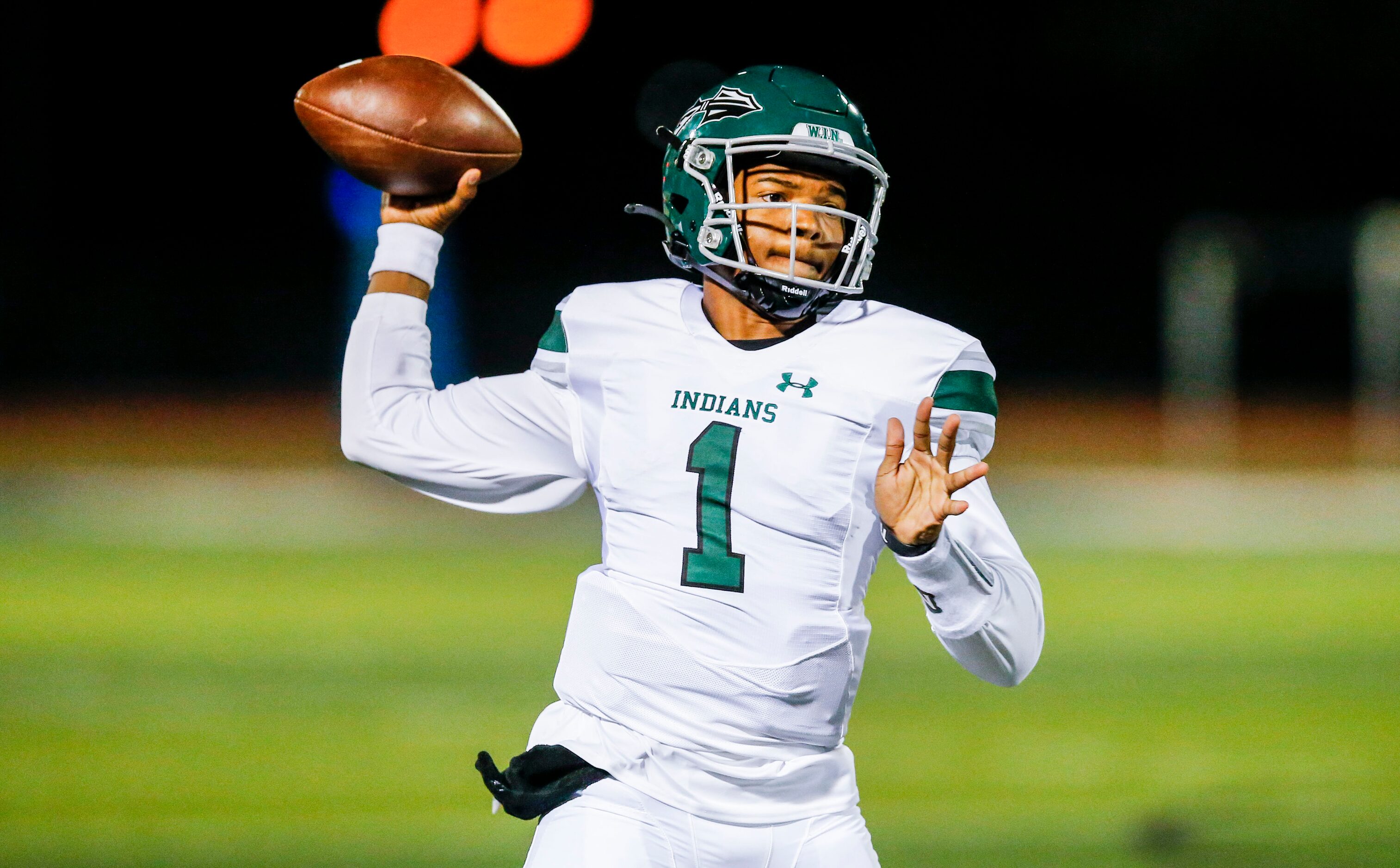 Waxahachie junior quarterback Roderick Hartsfield Jr. (1) throws during the first half of a...