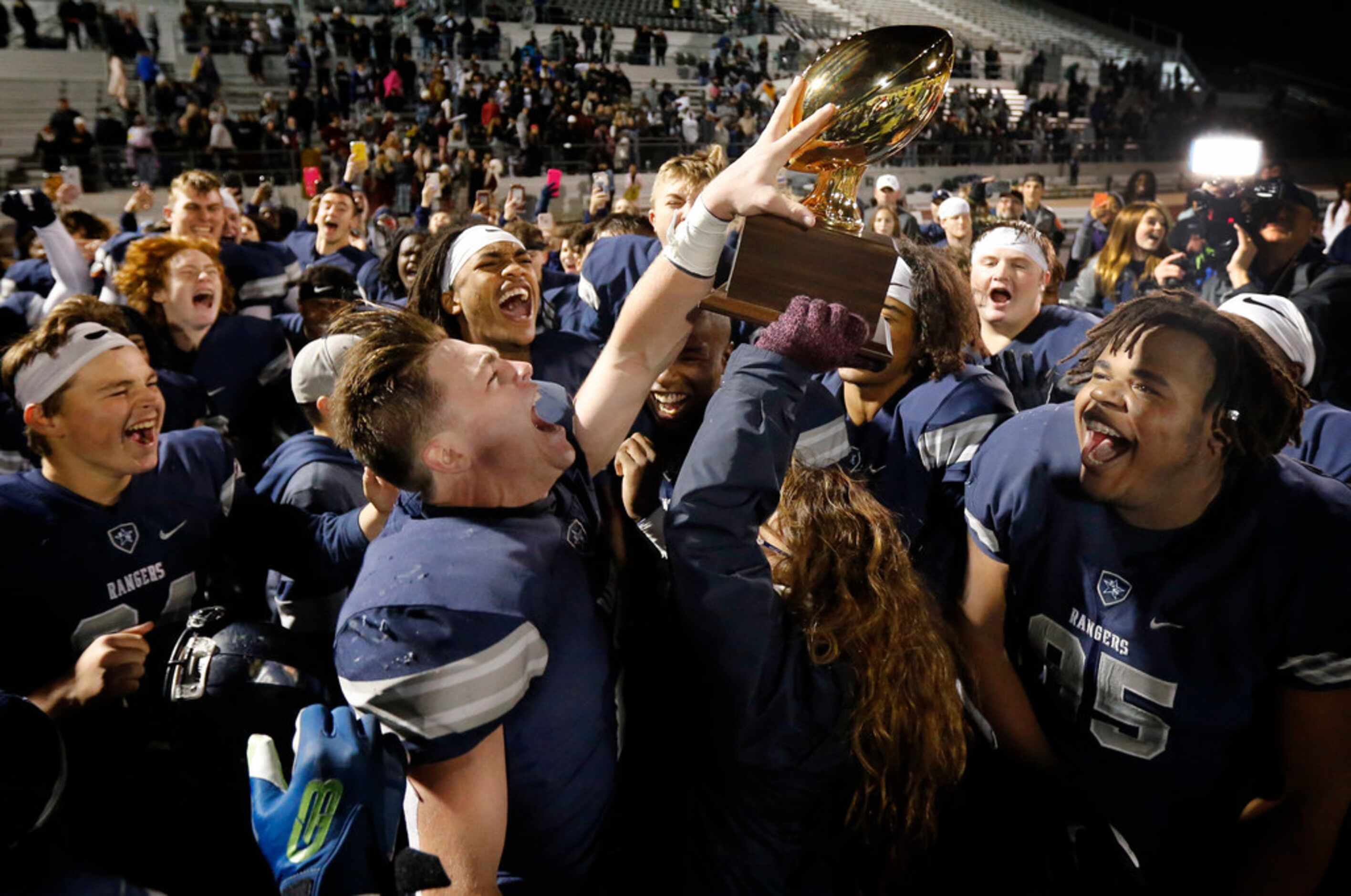 Frisco Lone Star players including receiver Jake Bogdon (2) and Cameron Jones (95) celebrate...