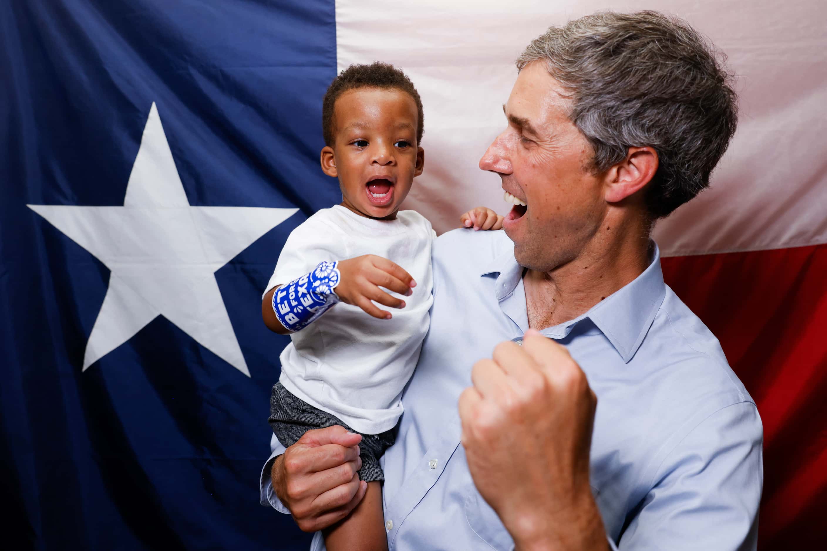 Texas Governor candidate Beto O'Rourke, right, reacts towards Hayden Hammonds, 1, as they...