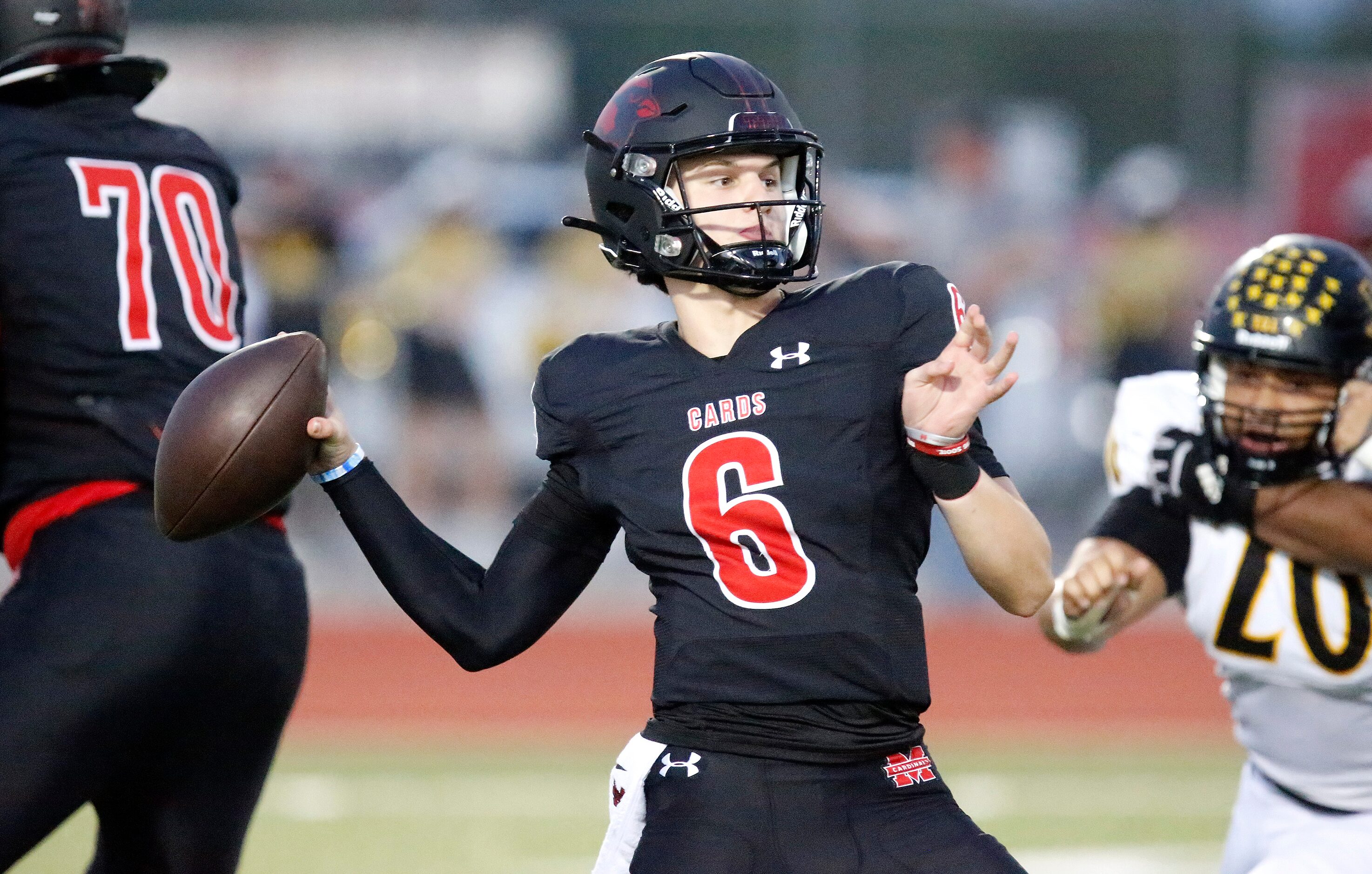 Melissa High School quarterback Trever Ham (6) throws a pass during the first half as...