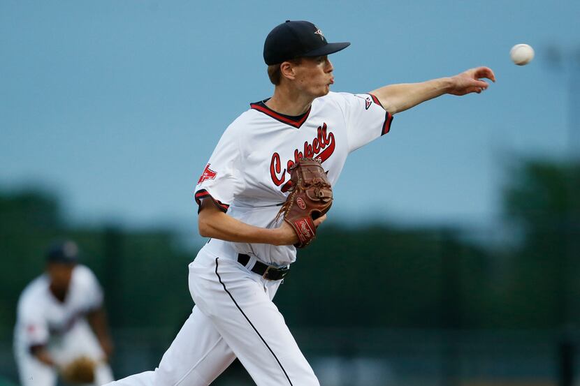 Coppell pitcher John K0dros pitches against Southlake Carroll during the top fourth inning...
