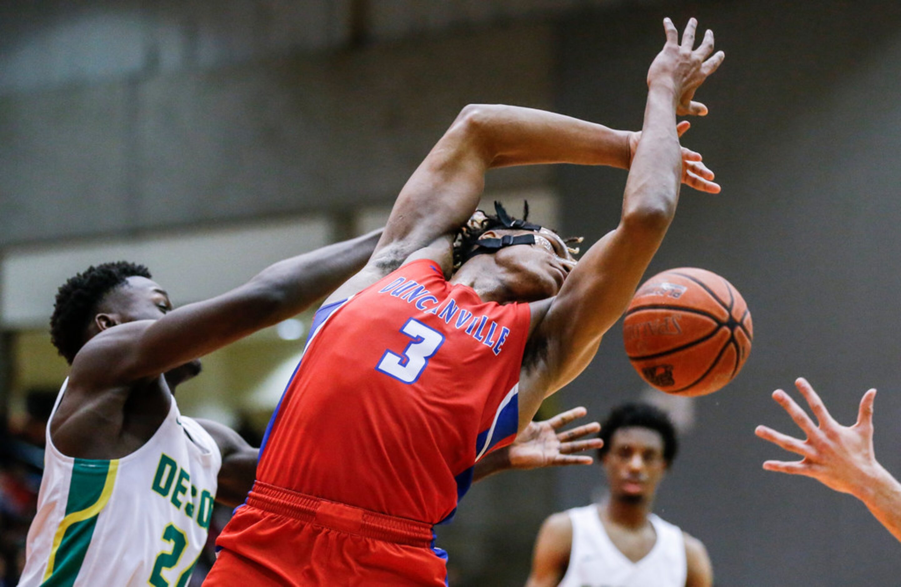 Duncanville senior guard Jahmi'us Ramsey (3) loses control of the ball as DeSoto senior...