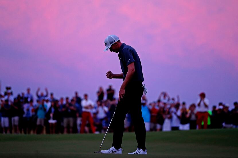 As darkness nears, Aaron Wise pumps his fist after winning AT&T Byron Nelson at Trinity...