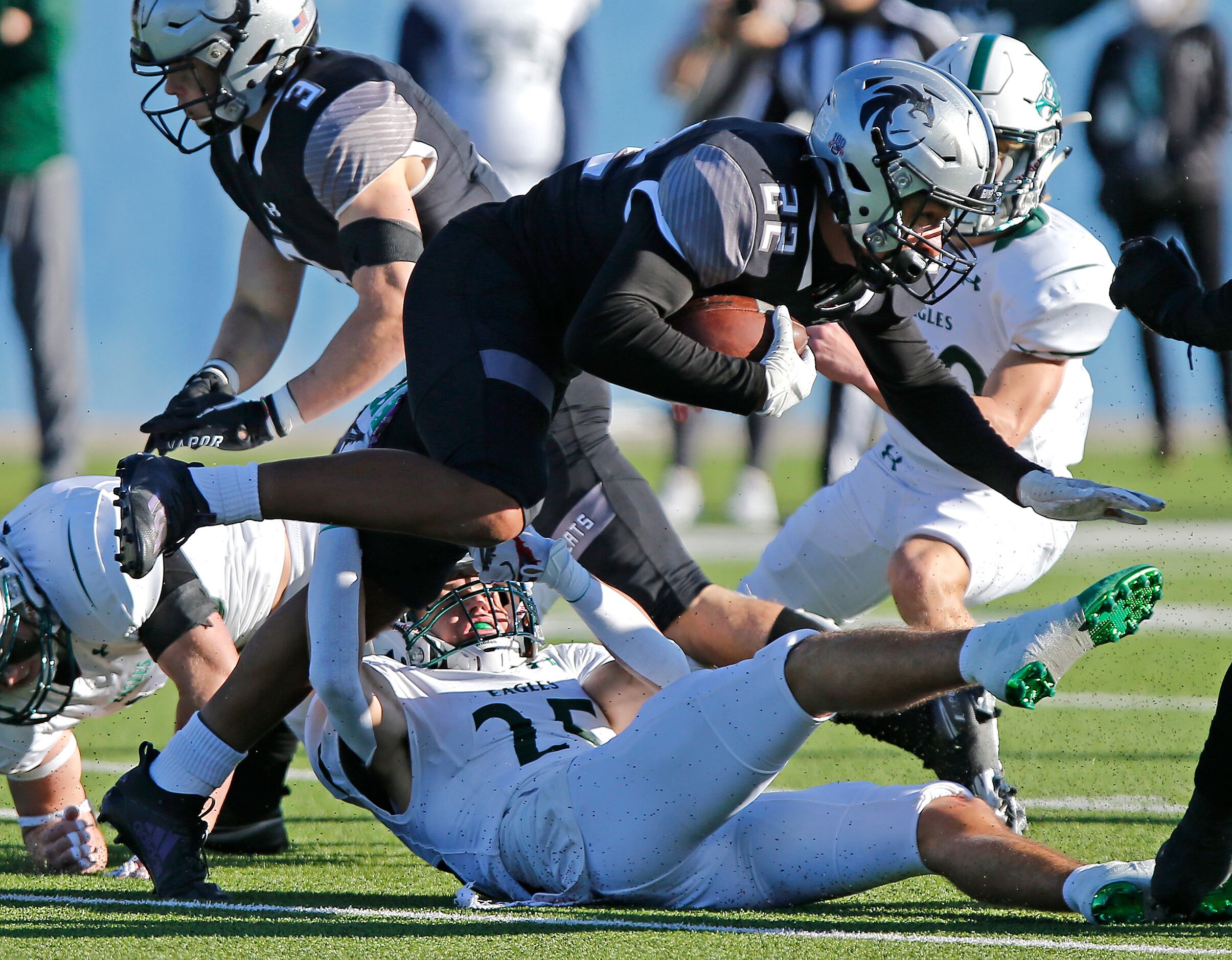 Denton Guyer High School cornerback Peyton Bowen (22) returns a kickoff and is tackled by...