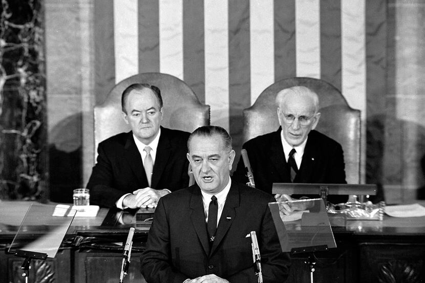In this March 15, 1965 photo, President Lyndon B. Johnson asks a joint session of Congress...